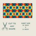 A rectangular tubie tape with a colorful repeating starburst pattern in red, orange, yellow, blue, and purple, shown on a light beige background with text reading 'CUT TO ANY SHAPE' and 'SHEET SIZE W-10CM X H-20CM'.