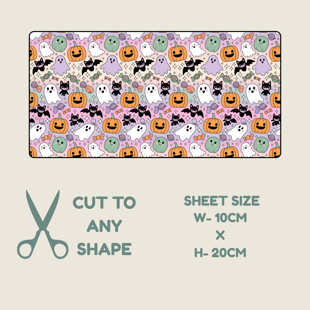 Tubie tape with a repeating Halloween pattern of pumpkins, ghosts, bats, and cats on a light pink background, shown above a beige panel with text reading 'CUT TO ANY SHAPE', 'SHEET SIZE W-10CM X H-20CM', and a scissors icon.