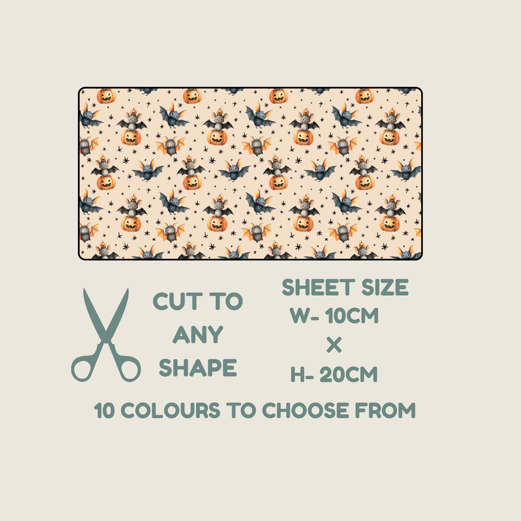 A fabric tubie tape sheet sample with a repeating Halloween print of pumpkins, bats, ghosts, and stars on a cream background, shown above text that reads 'CUT TO ANY SHAPE', 'SHEET SIZE W- 10CM x H- 20CM', and '10 COLOURS TO CHOOSE FROM'.