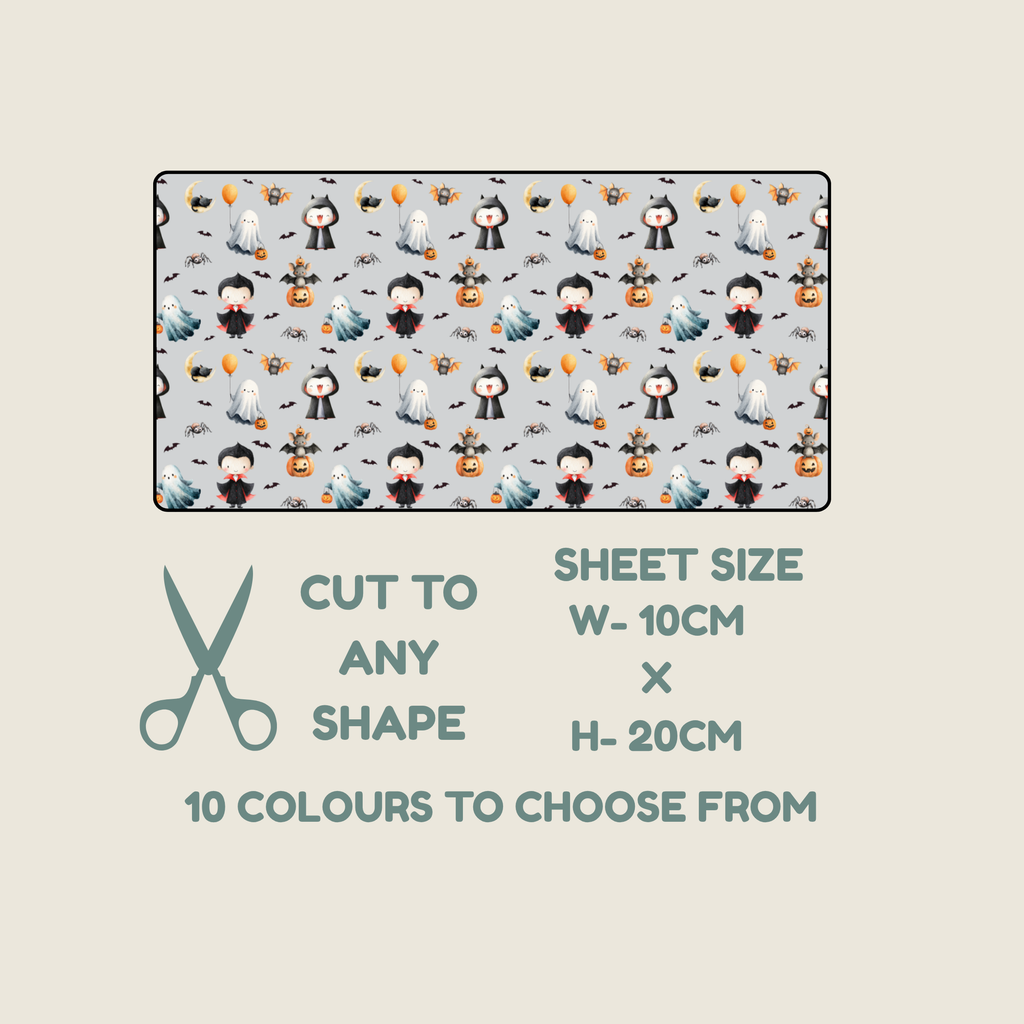 A fabric TUBIE TAPE  swatch preview with a Halloween-themed print showing cartoon ghosts, pumpkins, bats, and figures on a light gray background. Text below reads 'CUT TO ANY SHAPE', 'SHEET SIZE W-10CM x H-20CM', and '10 COLOURS TO CHOOSE FROM', with a scissors icon on a beige background.