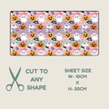 Tubie tape with a repeating Halloween pattern of pumpkins, ghosts, bats, and spiderwebs on a pastel background, shown above text reading 'CUT TO ANY SHAPE' and 'SHEET SIZE W-10CM x H-20CM' with a scissors icon on a light beige background.