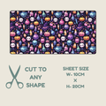 Tubie tape with a repeating colorful Halloween pattern of pumpkins, skulls, bottles, and cauldrons on a dark background, shown with text reading 'CUT TO ANY SHAPE' and 'SHEET SIZE W-10CM x H-20CM' on a light beige background.