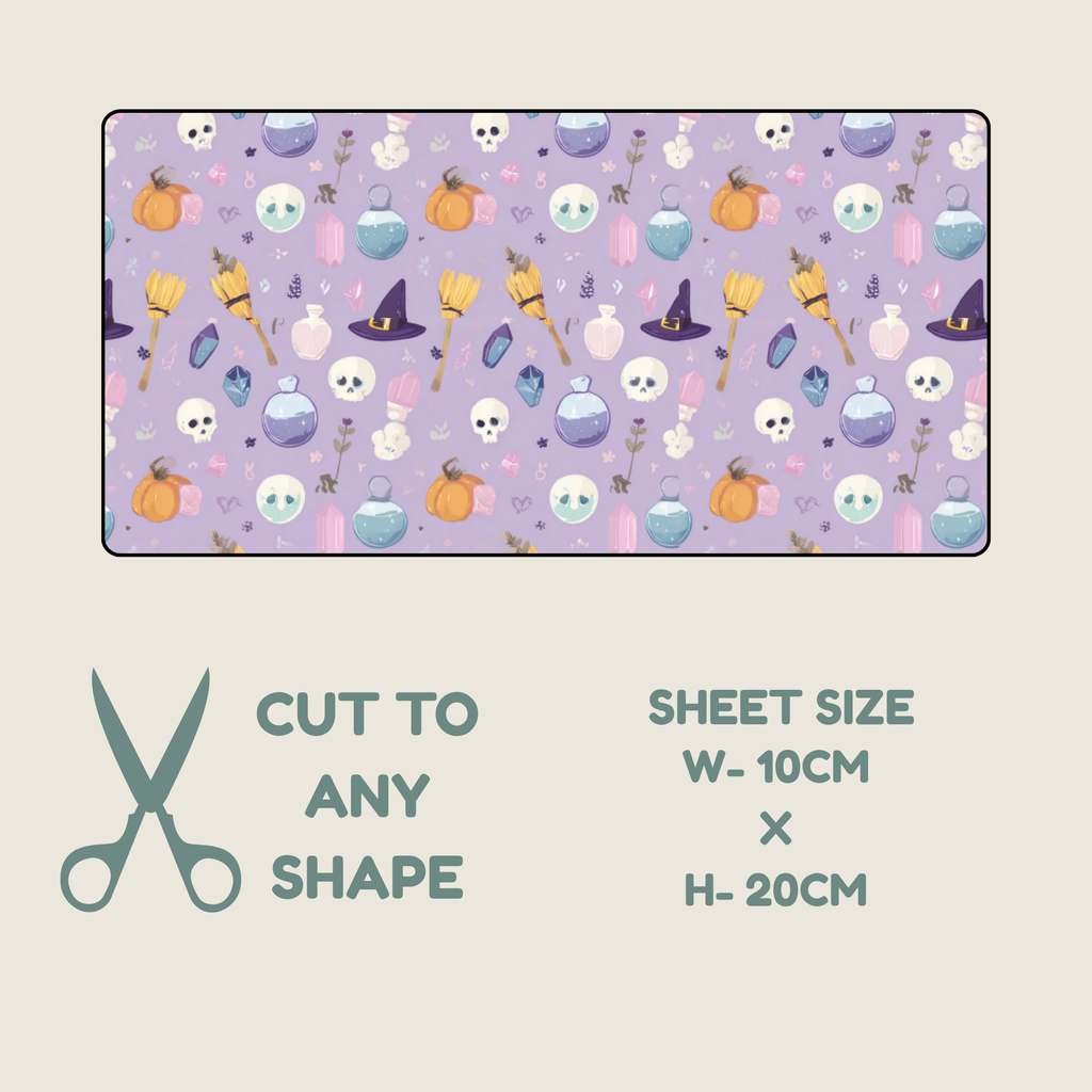 Tubie tape with a repeating illustrations of skulls, pumpkins, cauldrons, broomsticks, and witch hats. on a lilac background.  Below the sheet, text reads 'CUT TO ANY SHAPE' with a scissors icon, and text on the right reads 'SHEET SIZE W-10CM x H-20CM'.