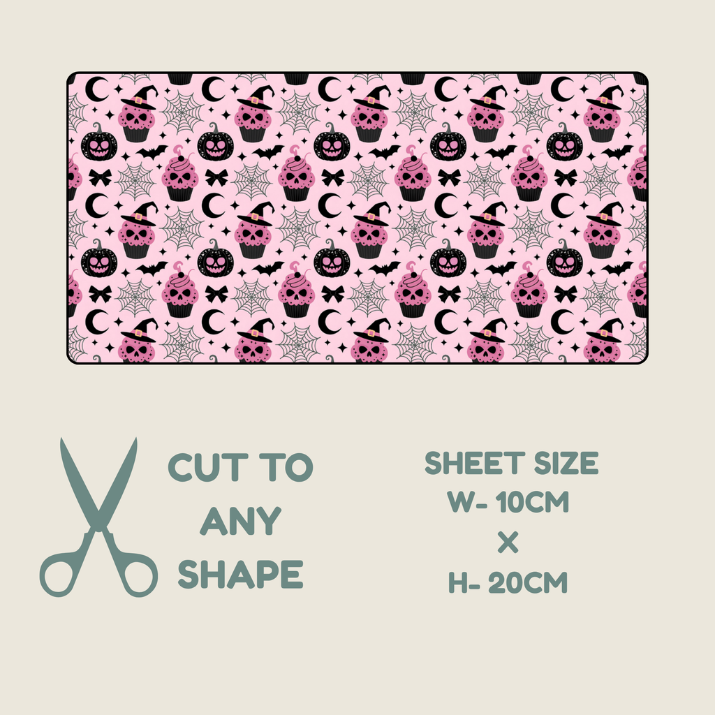 Tubie tape with a repeating Halloween-themed print of black cats, pink pumpkins, and white ghosts on a light pink background, shown with text indicating sheet size 10cm by 20cm and scissors icon for cutting.