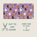 A Halloween-themed tubie tape preview on a light beige background. The top panel shows a lavender-purple rectangular sheet filled with repeating cartoon motifs including orange pumpkins, black and white cats, ghosts, witches' hats, bats, and small purple decorative elements.