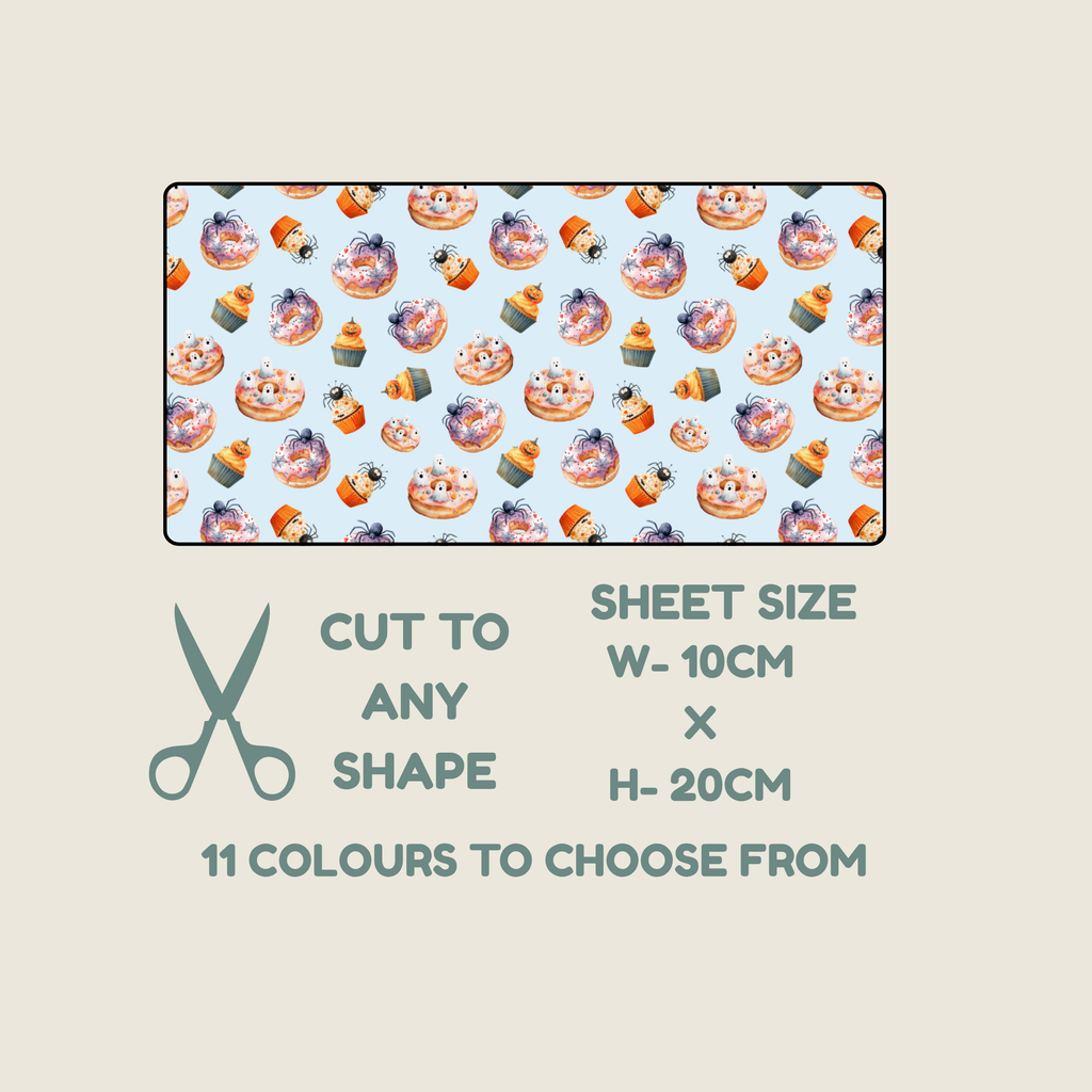 A tubie tape product listing graphic showing a rectangular sheet of fabric with a repeating illustrated pattern of cupcakes and donuts on a pale blue background. Below the fabric sample, text reads 'CUT TO ANY SHAPE', 'SHEET SIZE W- 10CM x H- 20CM', and '11 COLOURS TO CHOOSE FROM', with a scissors icon on a light beige background.
