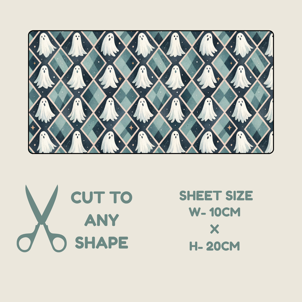 Halloween Tubie tape with a rectangular fabric or paper sheet with a repeating ghost and diamond pattern in teal, navy, and white, shown on a light beige background with text reading 'CUT TO ANY SHAPE' and 'SHEET SIZE W-10CM x H-20CM'.