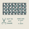 Halloween Tubie tape with a rectangular fabric or paper sheet with a repeating ghost and diamond pattern in teal, navy, and white, shown on a light beige background with text reading 'CUT TO ANY SHAPE' and 'SHEET SIZE W-10CM x H-20CM'.