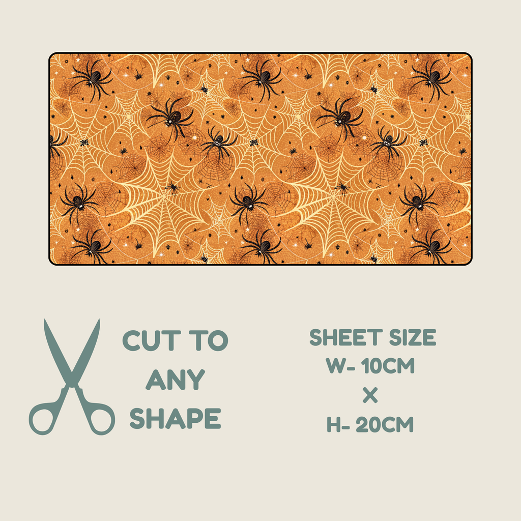 Halloween Tubie tape with a black spiders ans white webs on a orange background