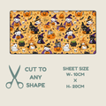 Tubie tape with a repeating pattern of cat witches, cat mummies and cats in pumpkins on a orange background