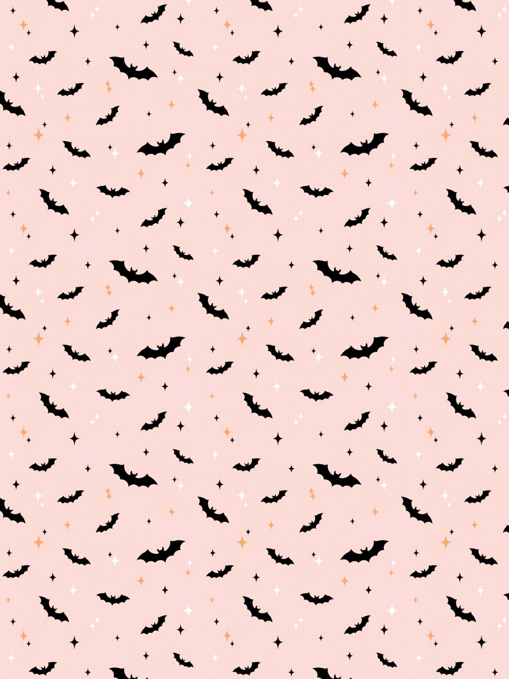 Tubie tape with a repeating Halloween pattern featuring black bats, small orange acorns, and white stars on a light pink background.