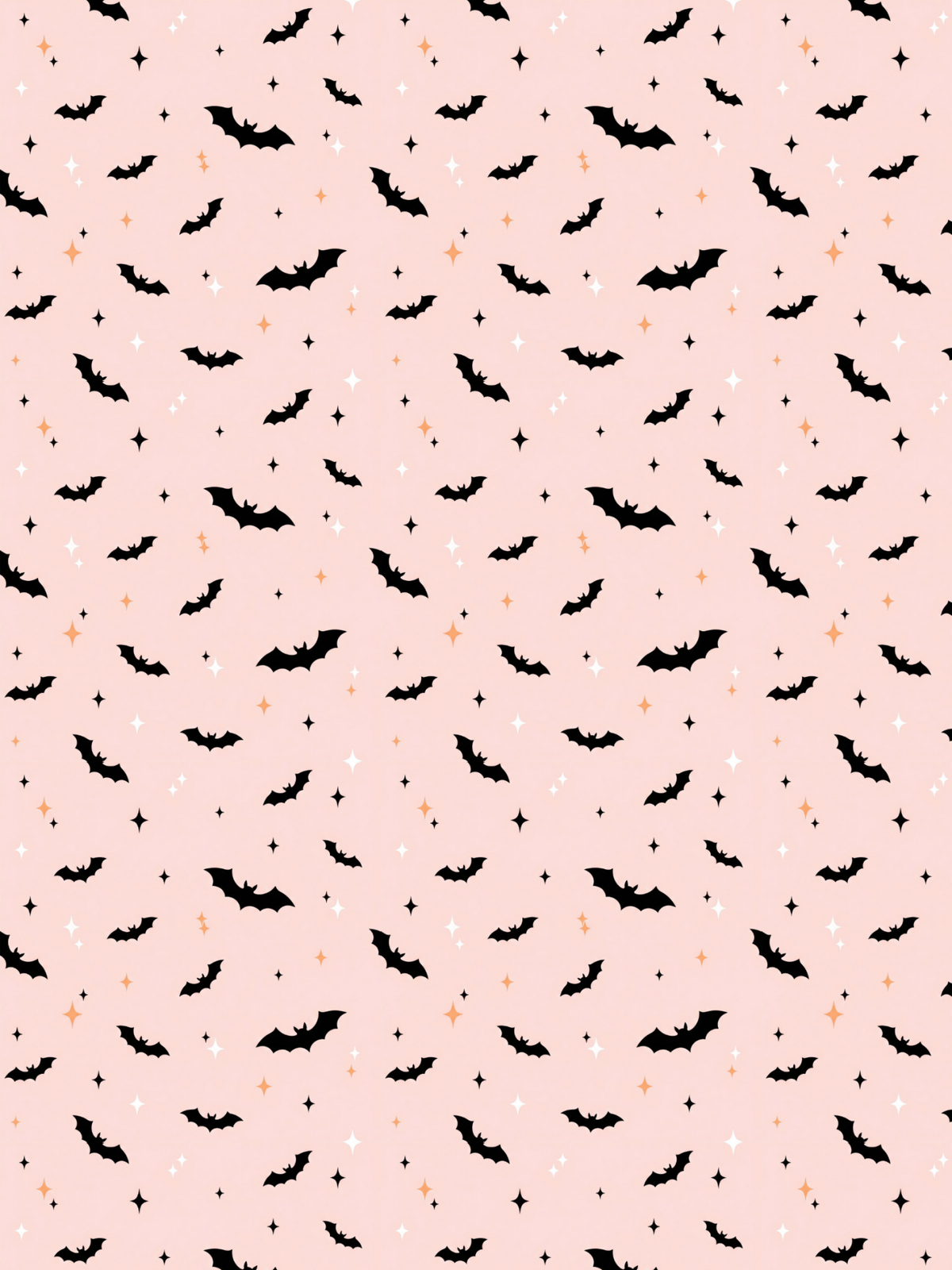 Tubie tape with a repeating Halloween pattern featuring black bats, small orange acorns, and white stars on a light pink background.