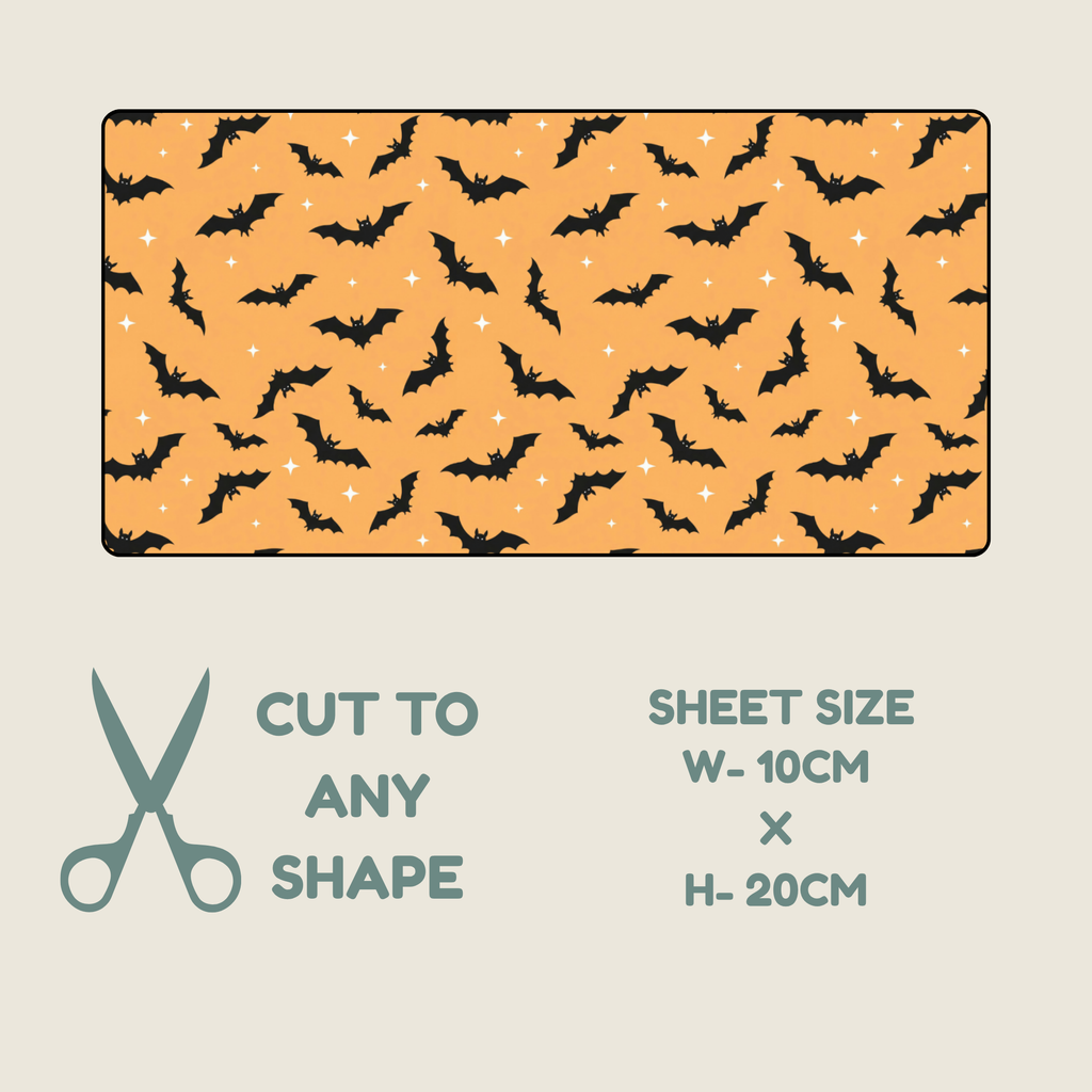 A rectangular sheet of orange tubie tape with a repeating black bat print and small white star accents, shown on a light beige background with text reading 'CUT TO ANY SHAPE' and 'SHEET SIZE W-10CM x H-20CM'.
