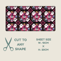 A rectangular sheet of hypoallergenic  tape with a repeating Halloween pattern of white ghosts, black cats, pink moons, and purple cauldrons on a black background, shown above a beige panel with scissors and text reading 'CUT TO ANY SHAPE' and 'SHEET SIZE W-10CM x H-20CM'.