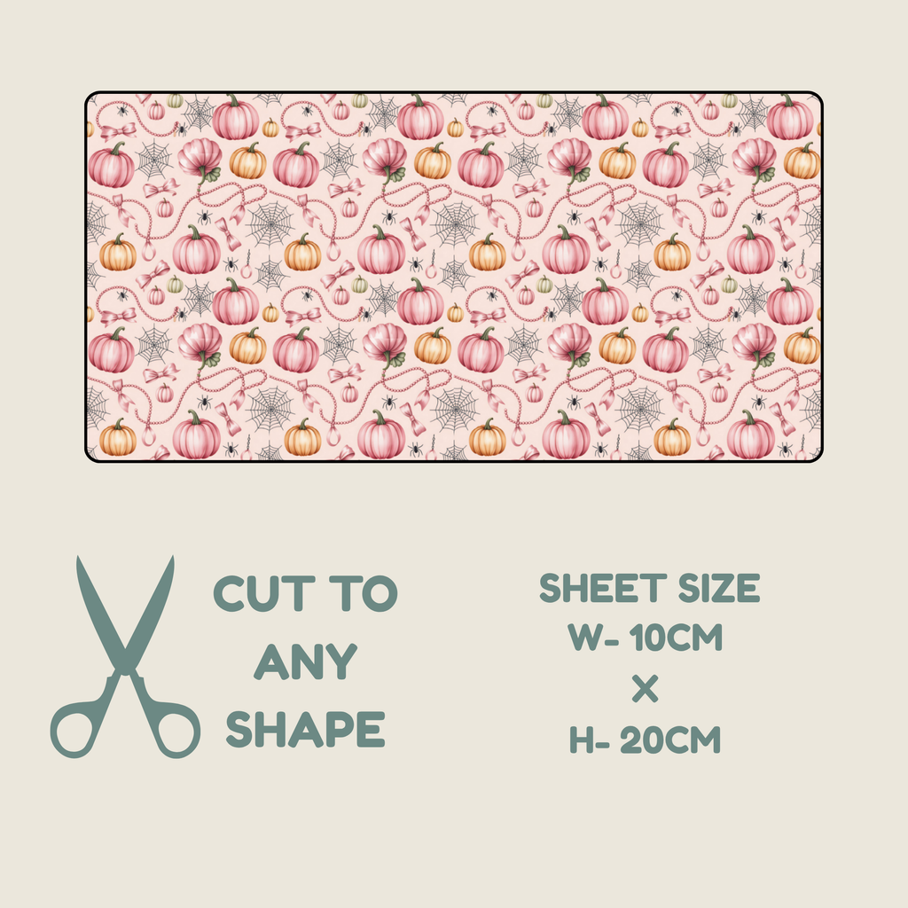 A rectangular fabric tubie tape with a repeating autumn pattern of pink and orange pumpkins, green vines, and gray starbursts on a pale pink background, shown above a beige panel with text reading 'CUT TO ANY SHAPE', 'SHEET SIZE W-10CM x H-20CM', and a scissors icon.