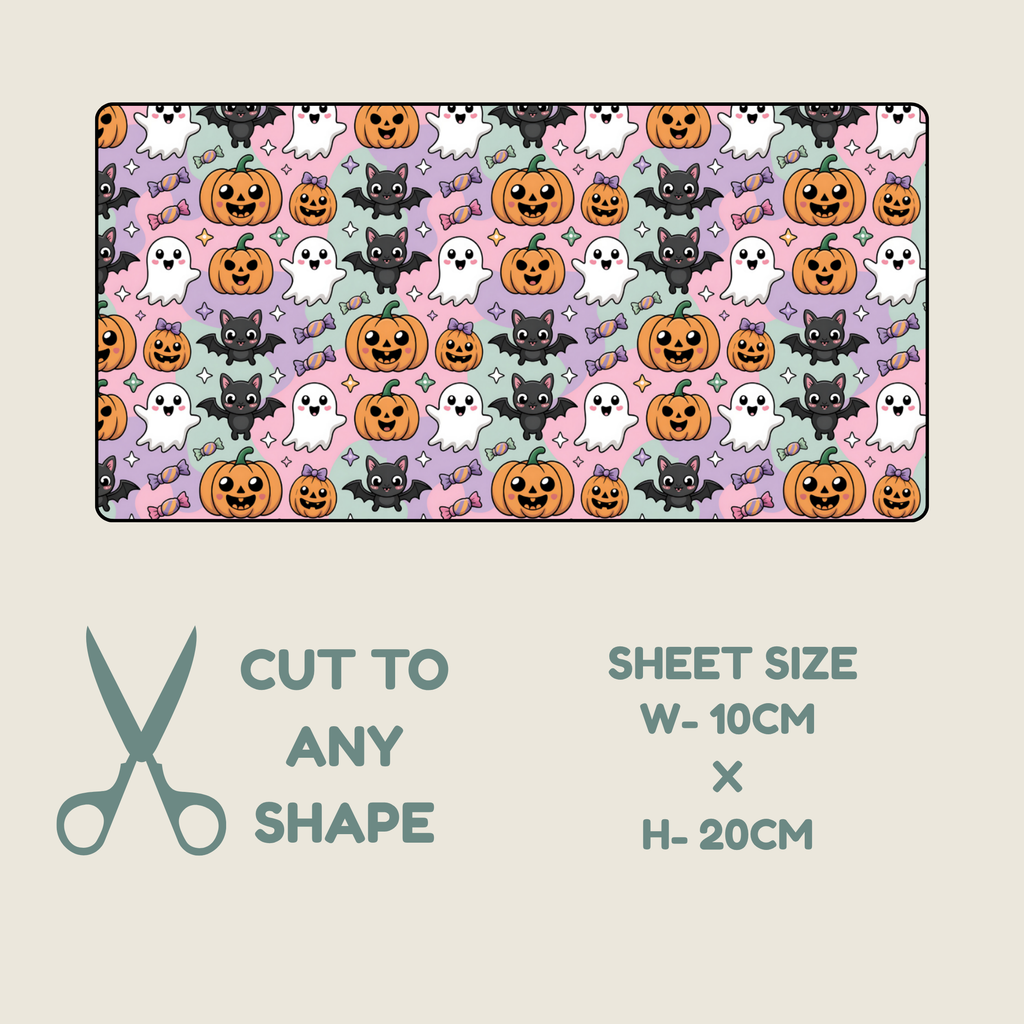 A rectangular sheet of tubie tape with a repeating Halloween pattern of pumpkins, ghosts, and cats on pastel pink, purple, and mint backgrounds, shown above a beige panel with scissors and text reading 'CUT TO ANY SHAPE' and 'SHEET SIZE W-10CM X H-20CM'.
