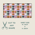 A rectangular sheet of tubie tape with a repeating Halloween pattern of pumpkins, ghosts, and cats on pastel pink, purple, and mint backgrounds, shown above a beige panel with scissors and text reading 'CUT TO ANY SHAPE' and 'SHEET SIZE W-10CM X H-20CM'.