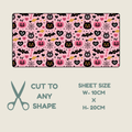  Tubie tape with a repeating Halloween pattern of black cats, pumpkins, bats, spiders, and hearts on a pink background, shown with text indicating sheet size 10cm x 20cm and the option to cut to any shape.