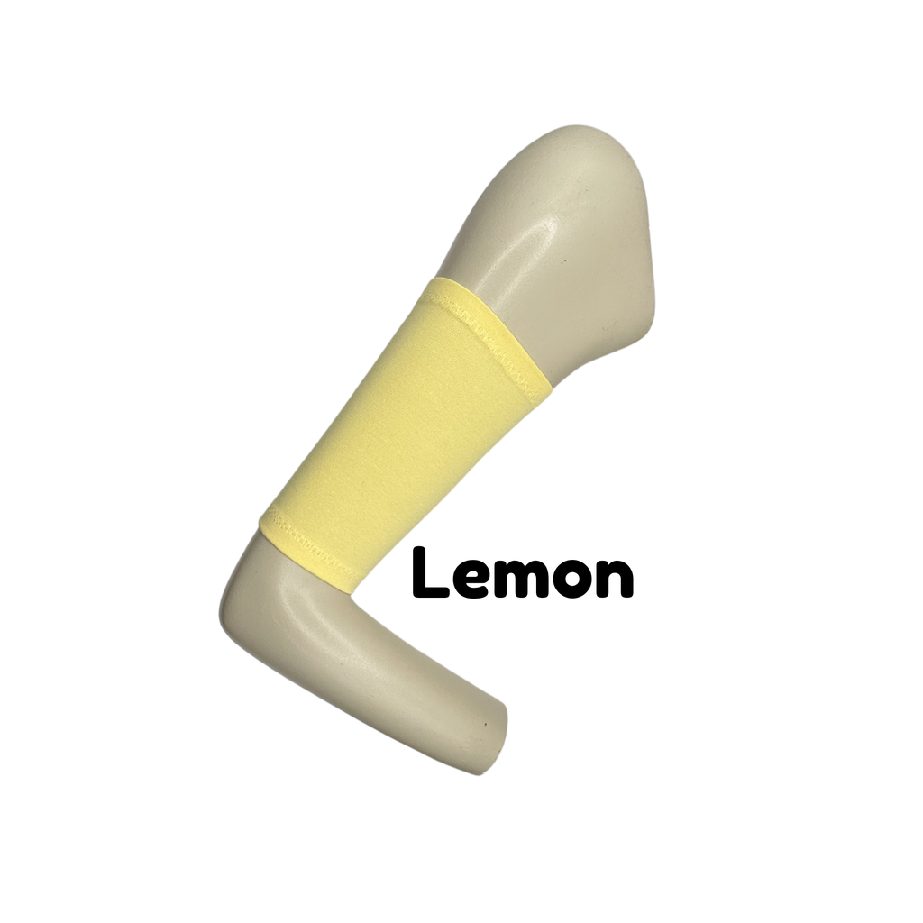 Cotton jersey armband in lemon colour. picc line cover is displayed on a mannequin arm. the words lemon  to indicate colour