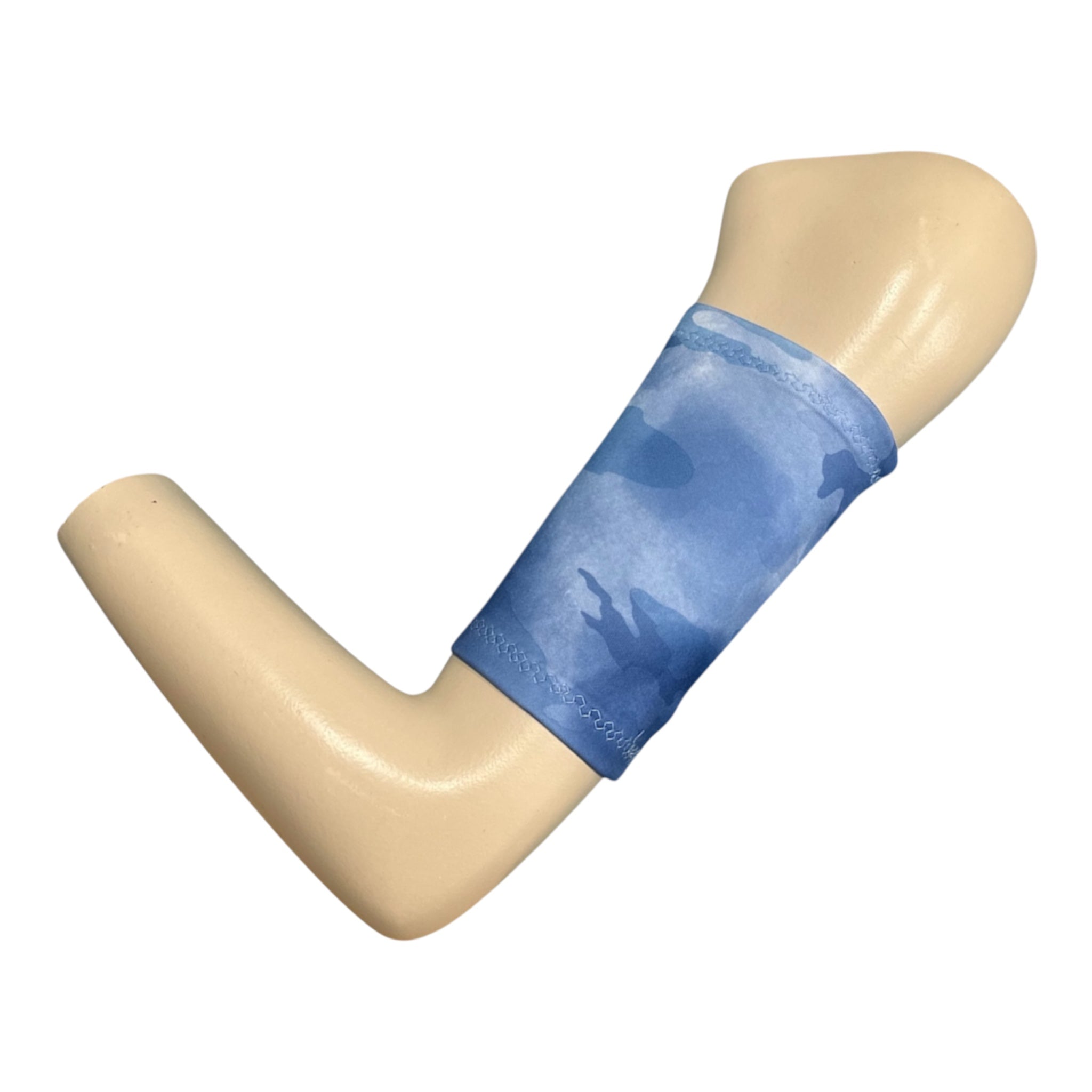A picc line cover made in scuba fabric with a camouflage print in a mix of blue colours. The armband is displayed on a mannequinn arm.